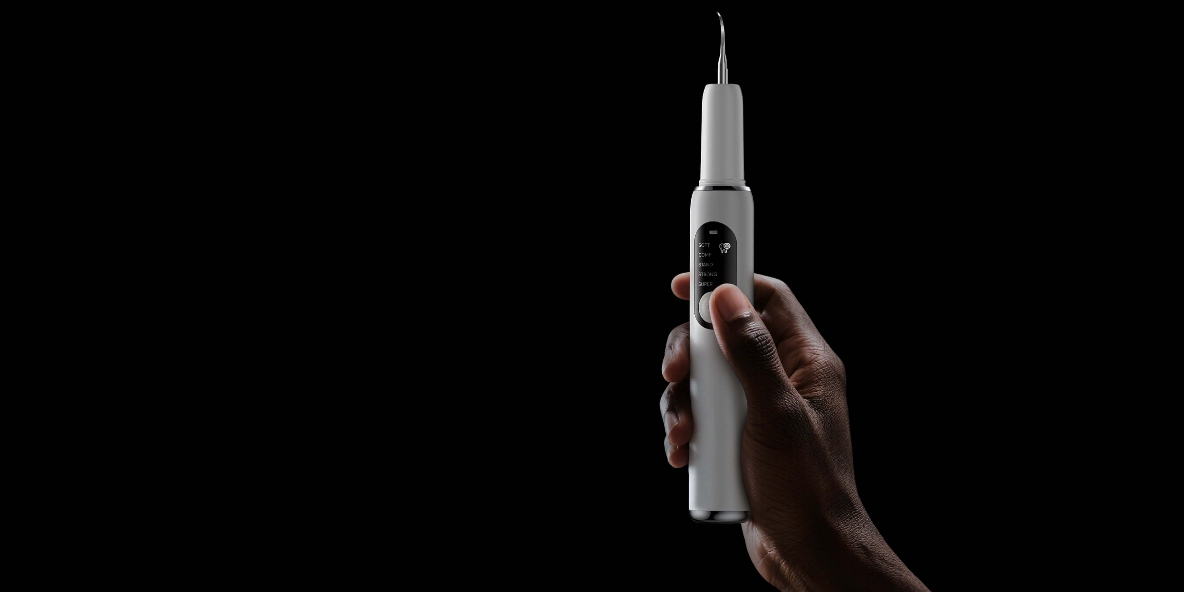 โPortable ultrasonic dental scaler with stainless steel tip and control panel showing Soft, Comfort, Normal, and Strong cleaning modes.โ
