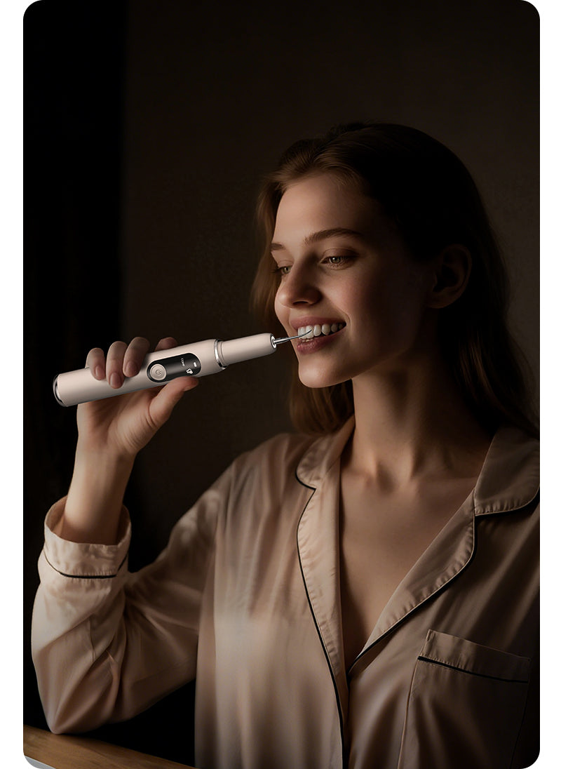 Happy woman having a positive brushing experience with her sonic electric toothbrush at home