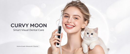 Smiling woman holding a Curvy Moon handheld oral care device beside a white cat.