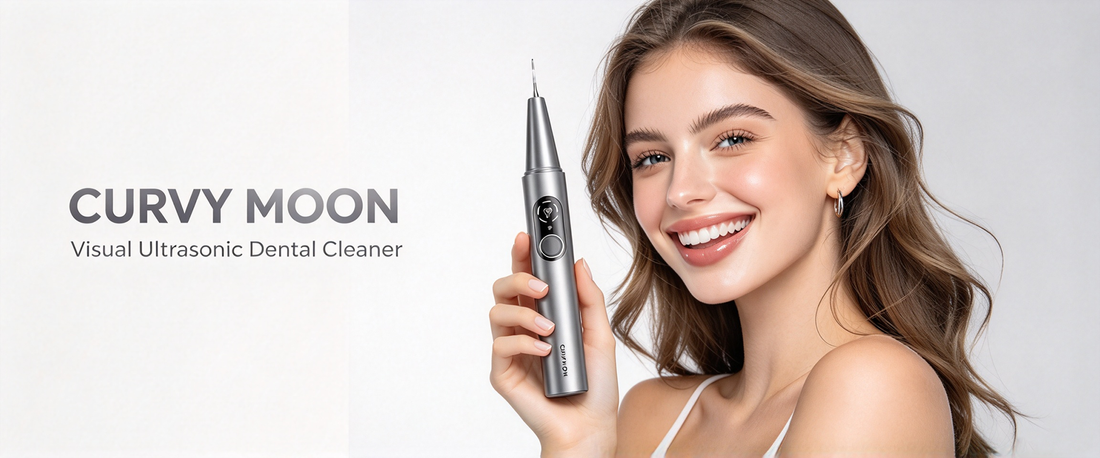 Smiling woman holding a silver Curvy Moon handheld dental cleaner beside her face